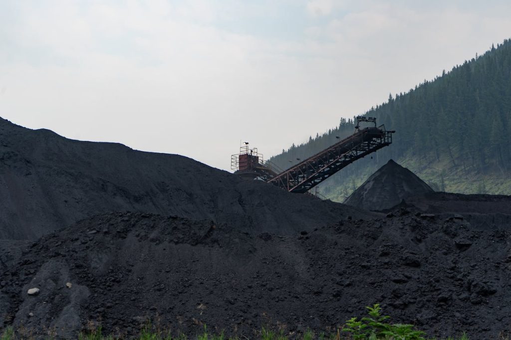 Industrial coal processing facility in Elkford, Canada with large coal piles.